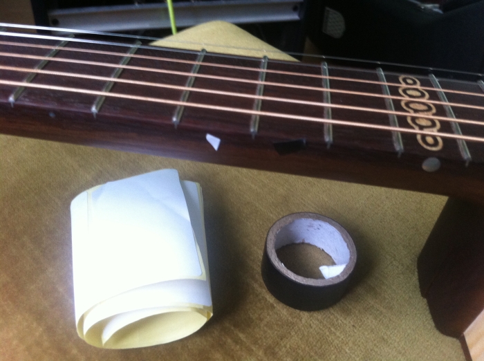 Using white sticky paper and black tape to temporarily  "correct' the 10th fret marker